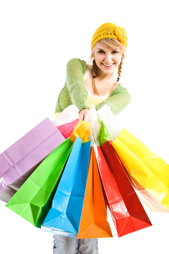 A beautiful caucasian girl carrying shopping bags